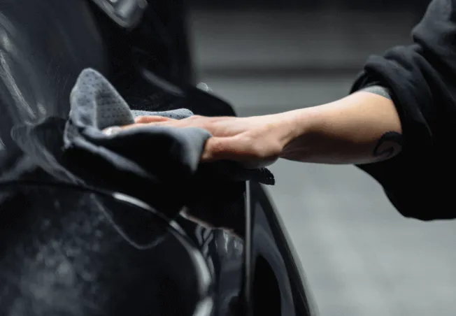 Polishing a ceramic coating on a black car paint