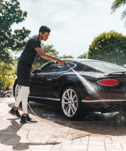 Owner at washing a customers car